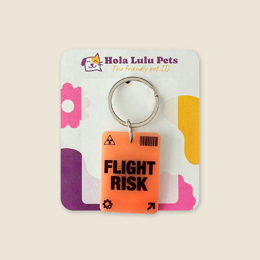 High visibility orange "FLIGHT RISK" warning illustration on a durable safety QR dog tag by Hola Lulu Pets.
