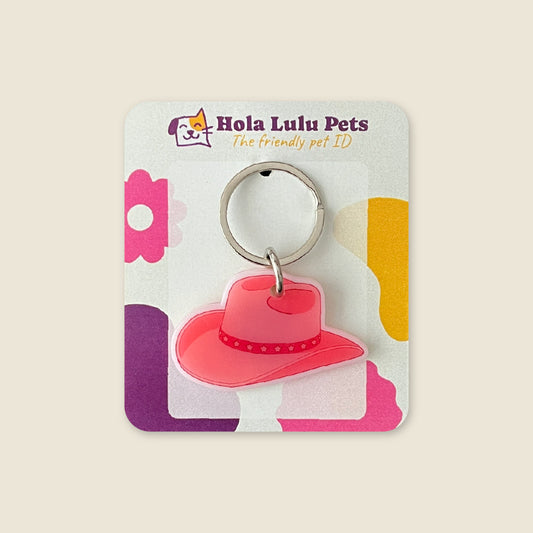 Pink cowgirl hat western trend illustration on a durable white acrylic QR code pet tag by Hola Lulu Pets.