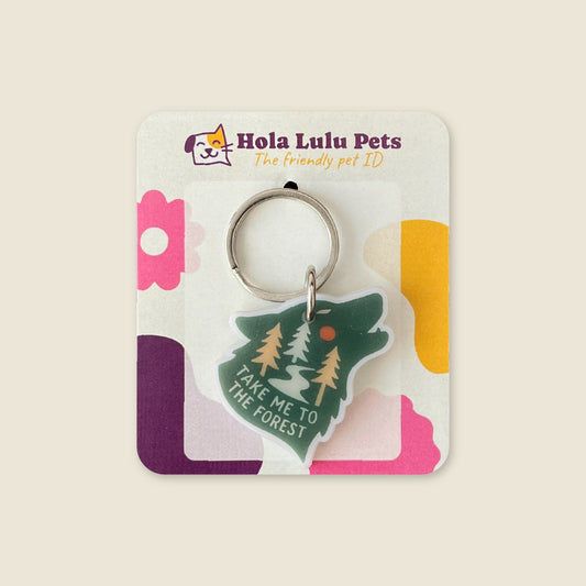 "Take me to the forest" wolf illustration on a durable white acrylic QR code adventure dog tag by Hola Lulu Pets.